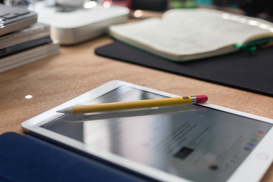 yellow pencil on white iPad