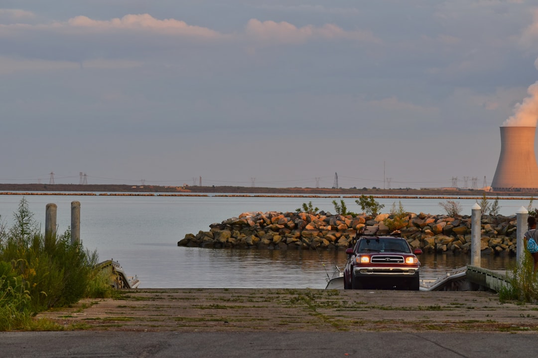 Shot from a small beach access area in Delaware, this place provided a short private getaway that we thoroughly enjoyed. by History Hidden a car parked on a road by a body of water