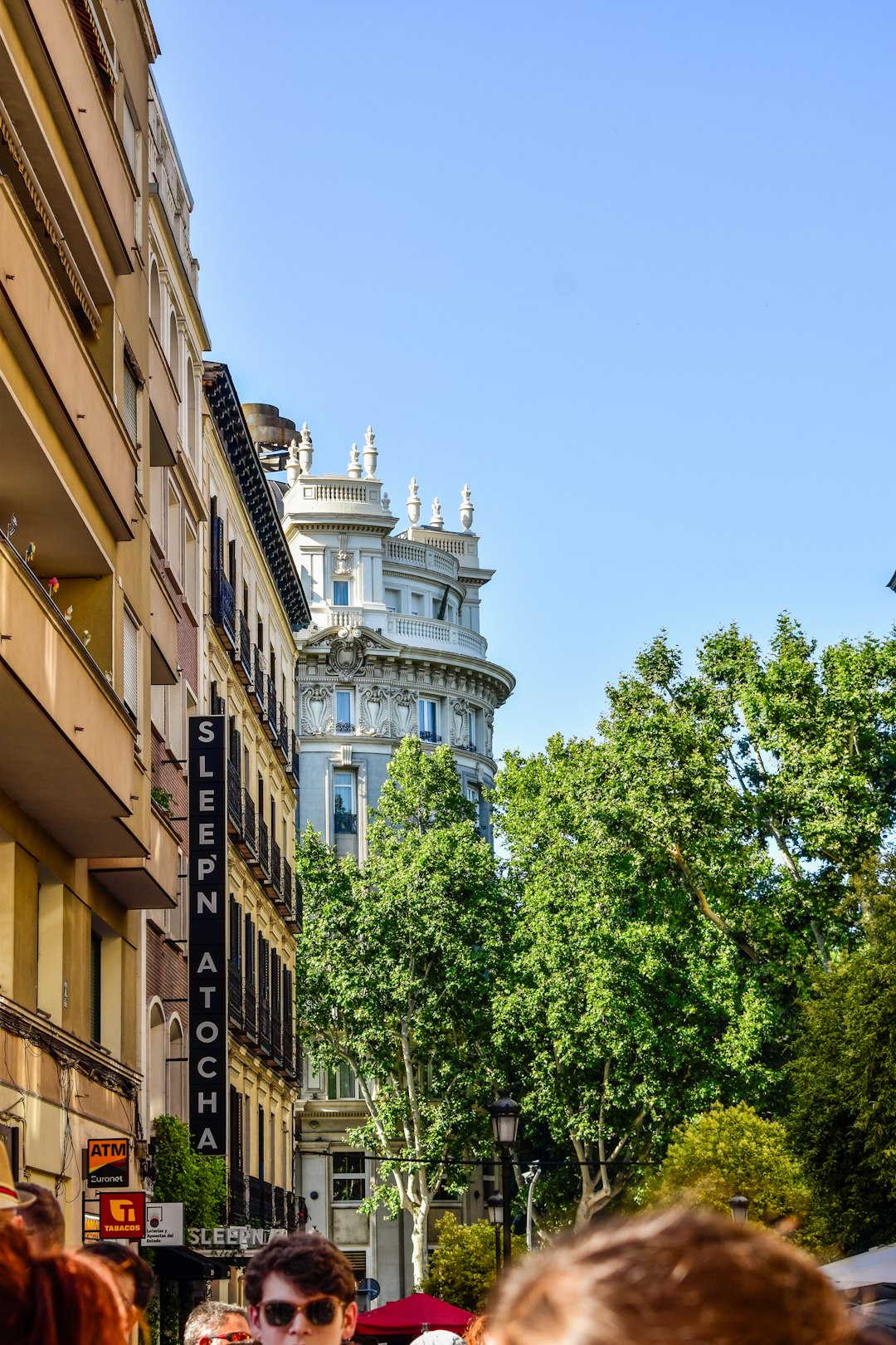 Preserving History: Museums and Exhibits Featuring the Atocha’s Artifacts 🏛️ by History Hidden A group of people walking down a street next to tall buildings