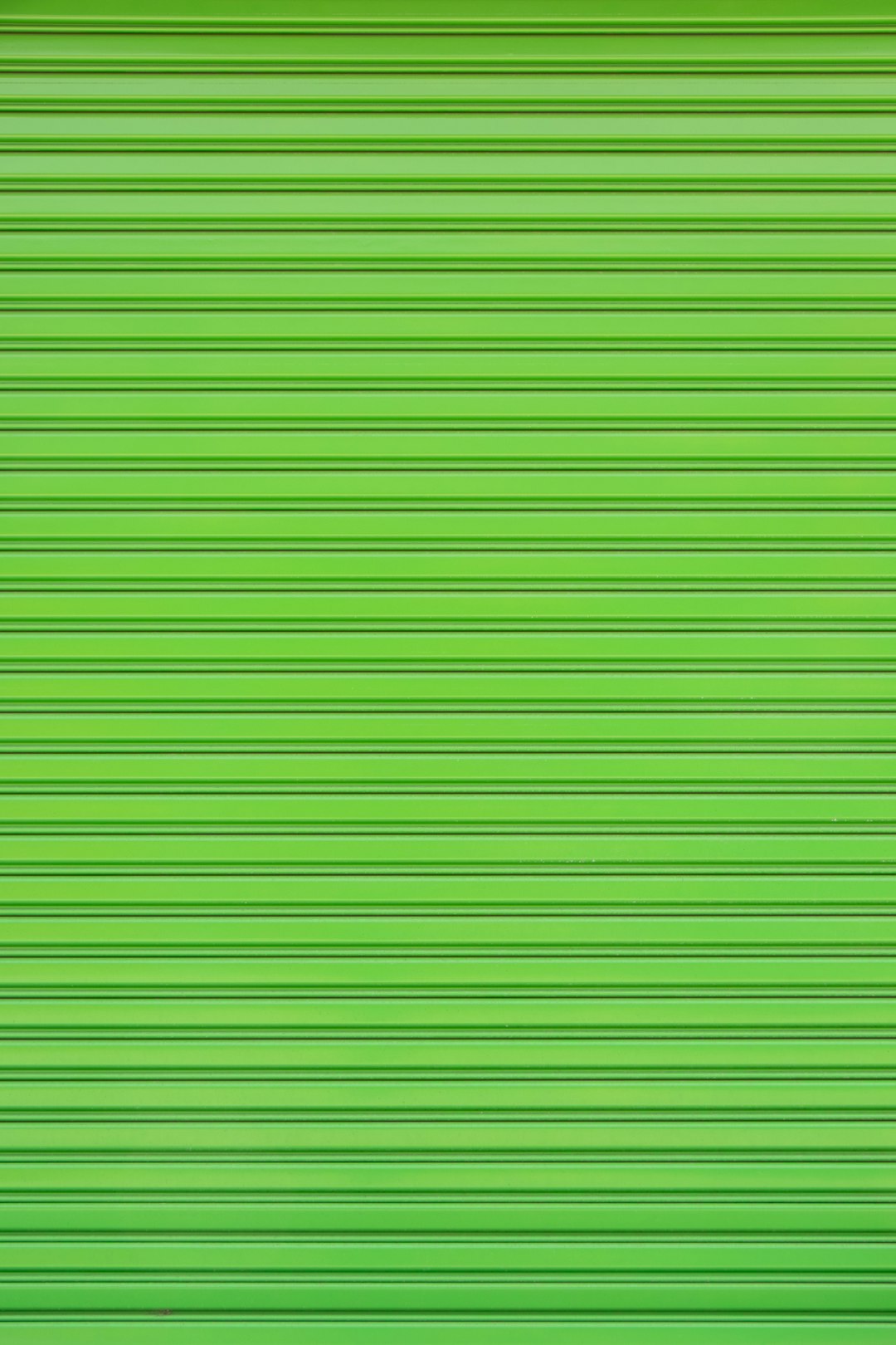 a close up of a green garage door