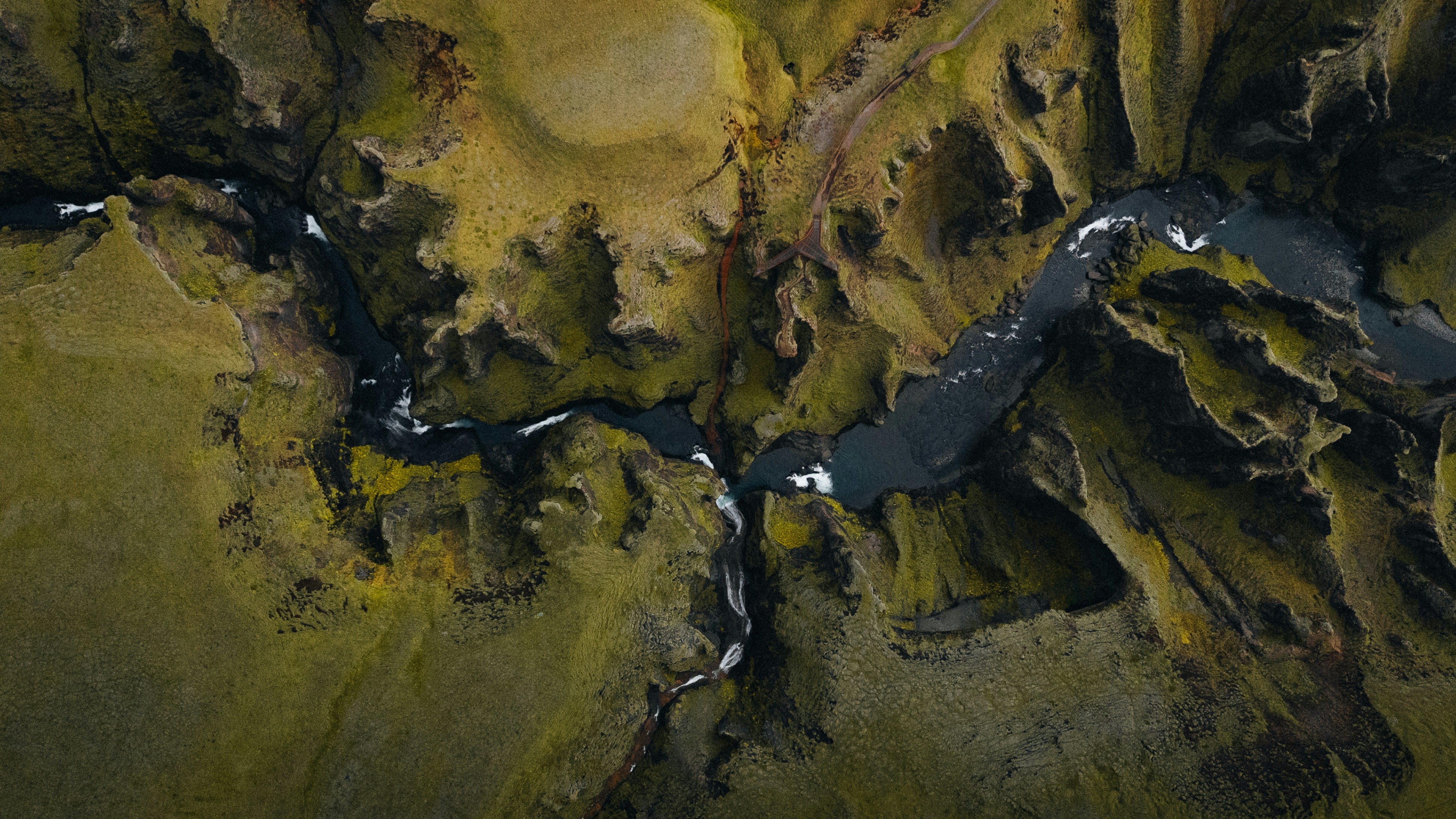 A winding river flows through a canyon.